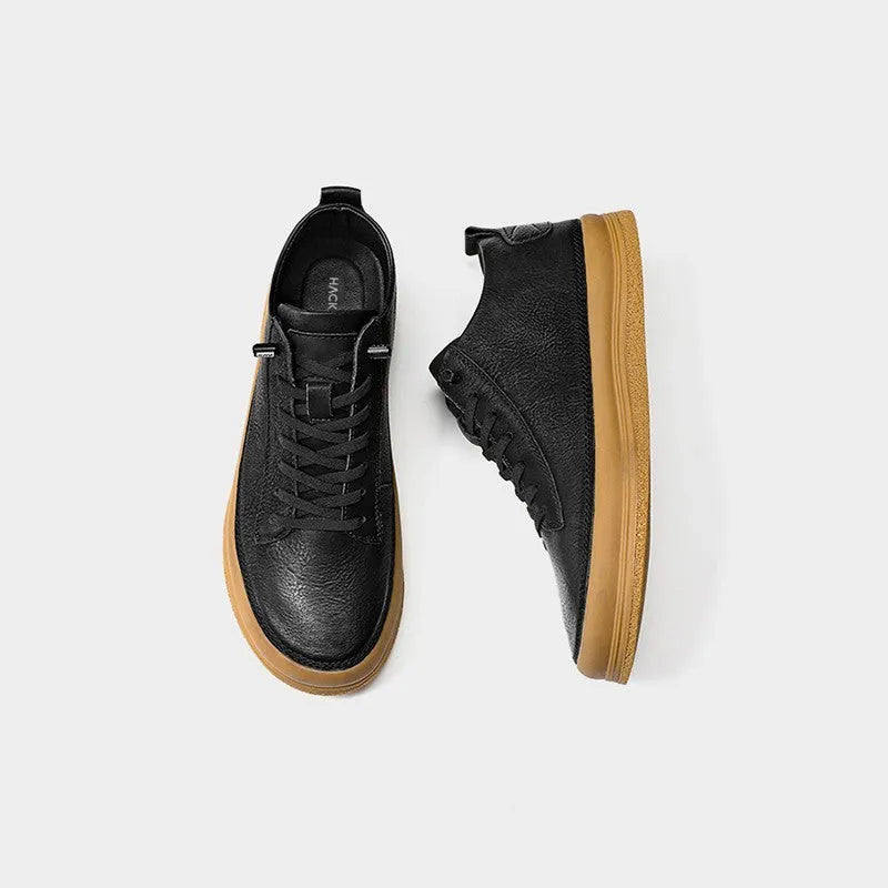Men's black and white leather casual shoes with rubber soles and lace-up closure