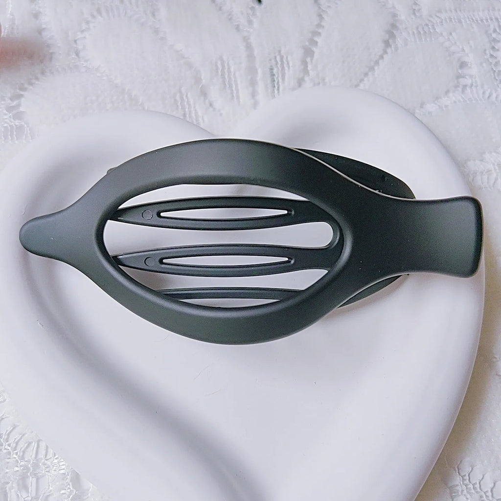 Set of six rose red nude coloured women's plastic hair clips with quadrilateral design on a white background.
