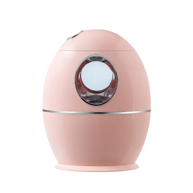 Small white aromatherapy humidifier with USB cable, water tank, and mist output