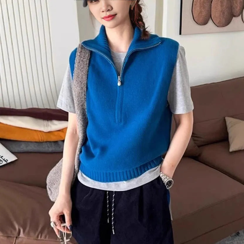 Women's sleeveless half-zip knit vest in mesh fabric, shown in a solid colour with a 3D pattern.
