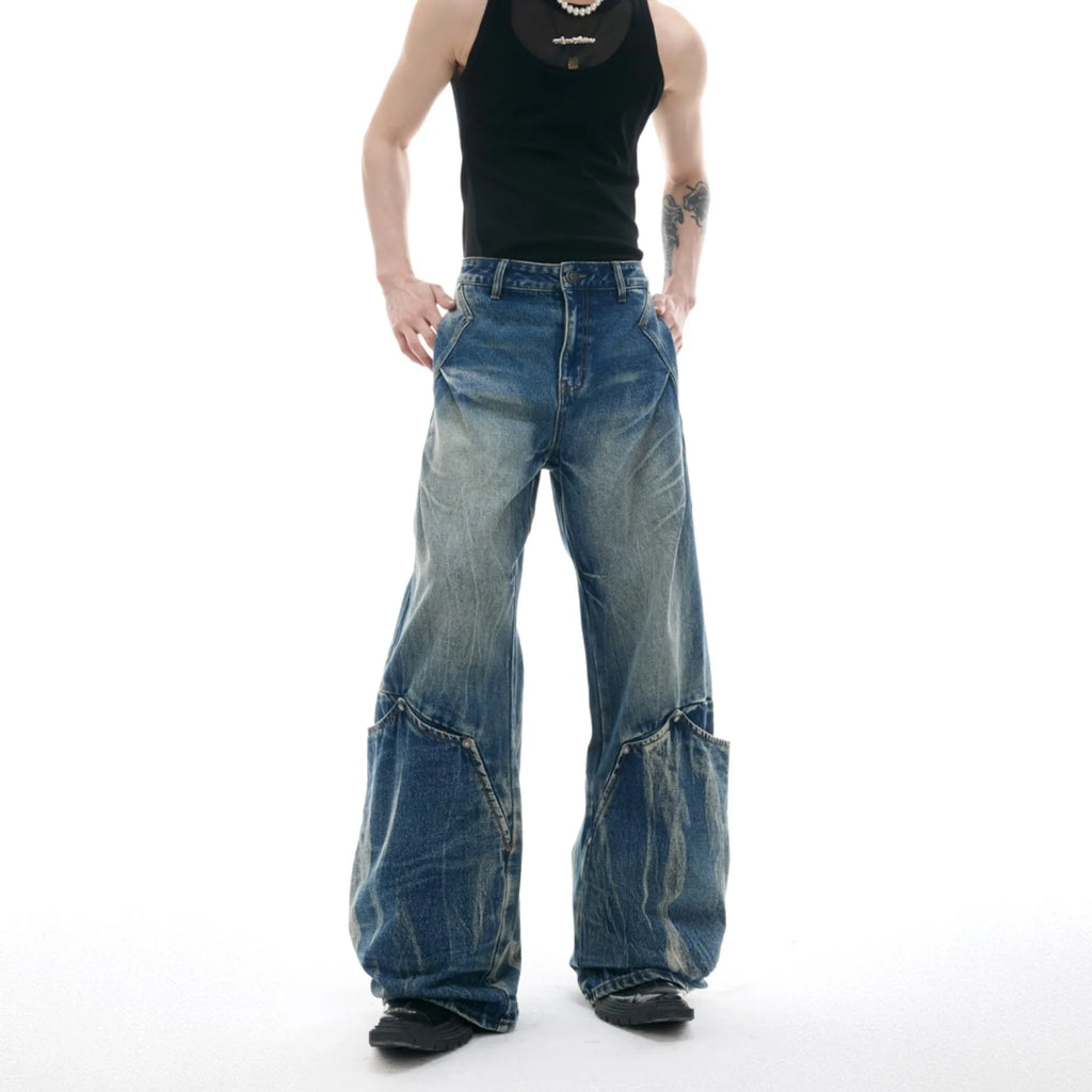 Men's retro washed burst pattern curved knife jeans in verdant blue colour showing loose fit design