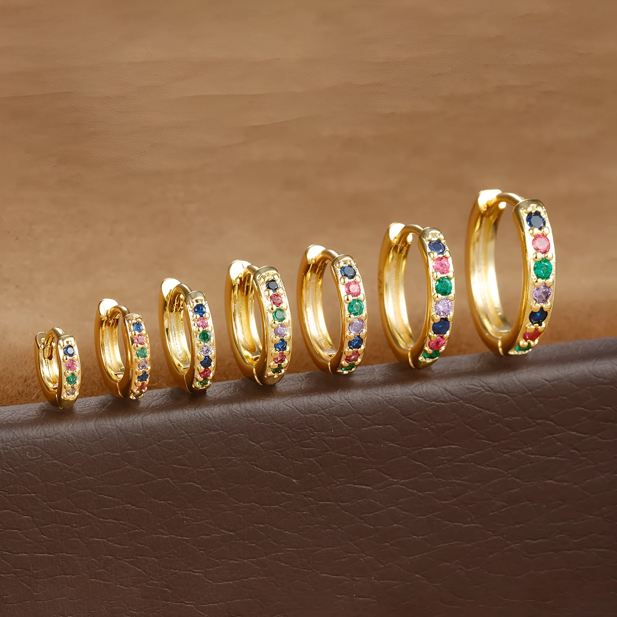 Circle zircon perforated stud earrings in gold, rose gold, and silver colours showing geometric round design with multiple size options