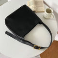 Women's soft PU leather shoulder bag with decorative threads measuring 28x32x12cm in black and brown colour options