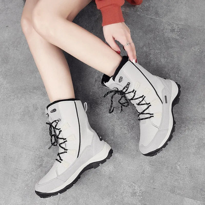 Women's mid-calf thermal snow boots in genuine leather with round toe and rubber sole