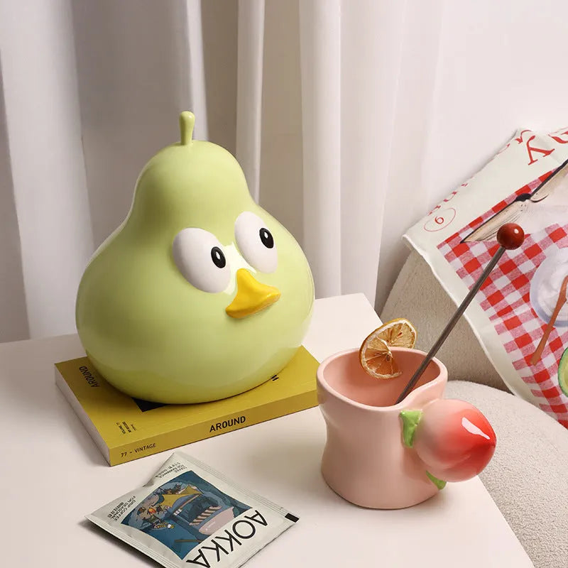 White ceramic pear-shaped tissue box holder with cute animal design in green glaze finish