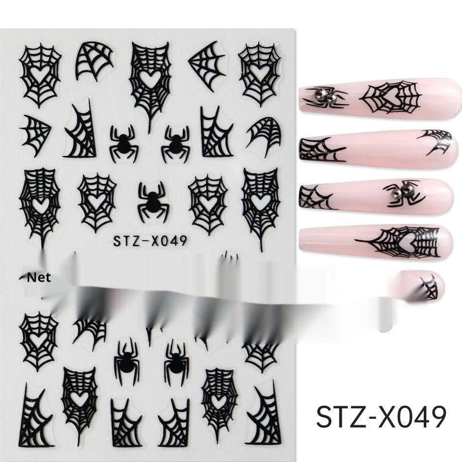 Close-up of a cartoon-style nail sticker with black and silver strips and a love pattern design on a fingernail.