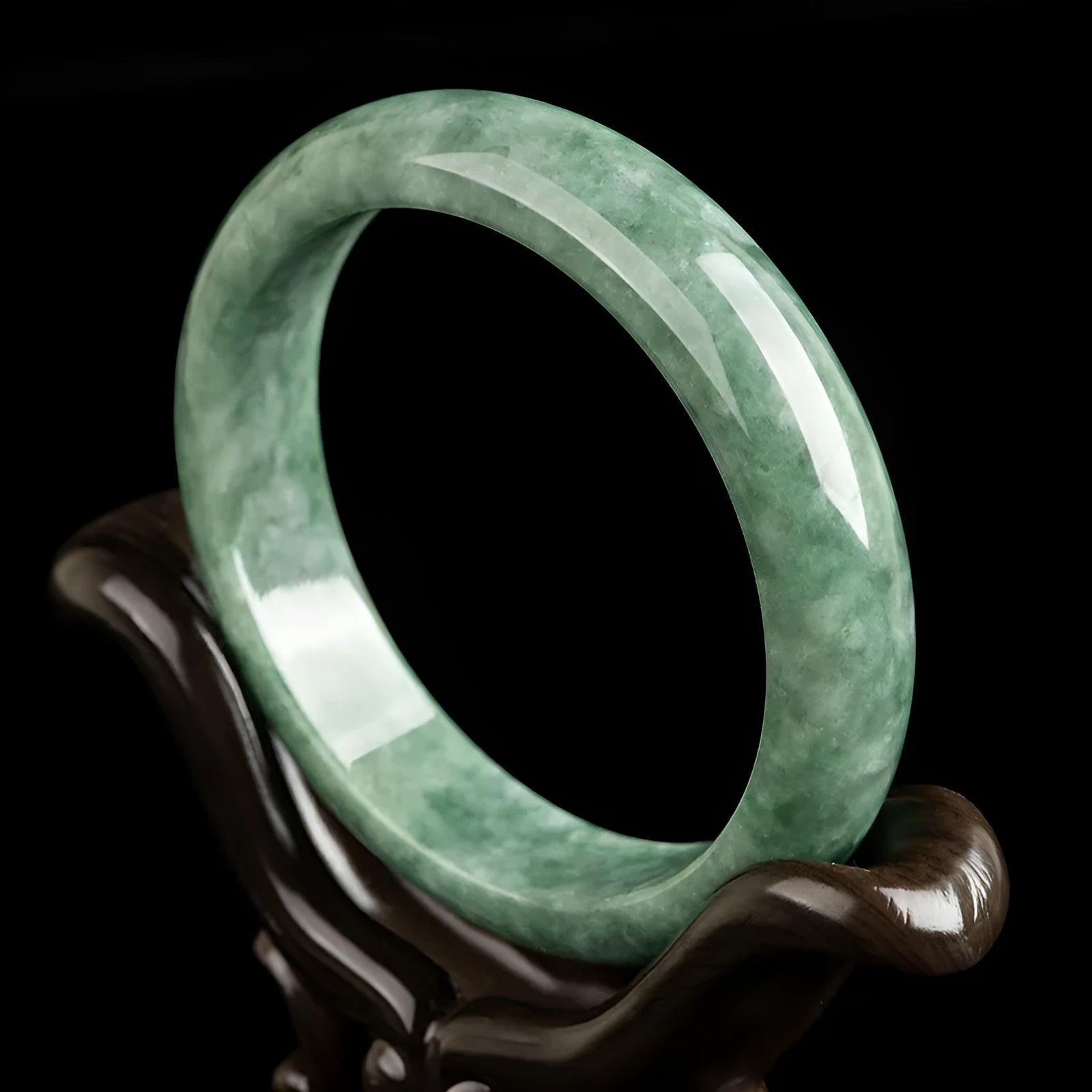 A simple natural emerald green jade bracelet for women, presented with a certificate and gift box.
