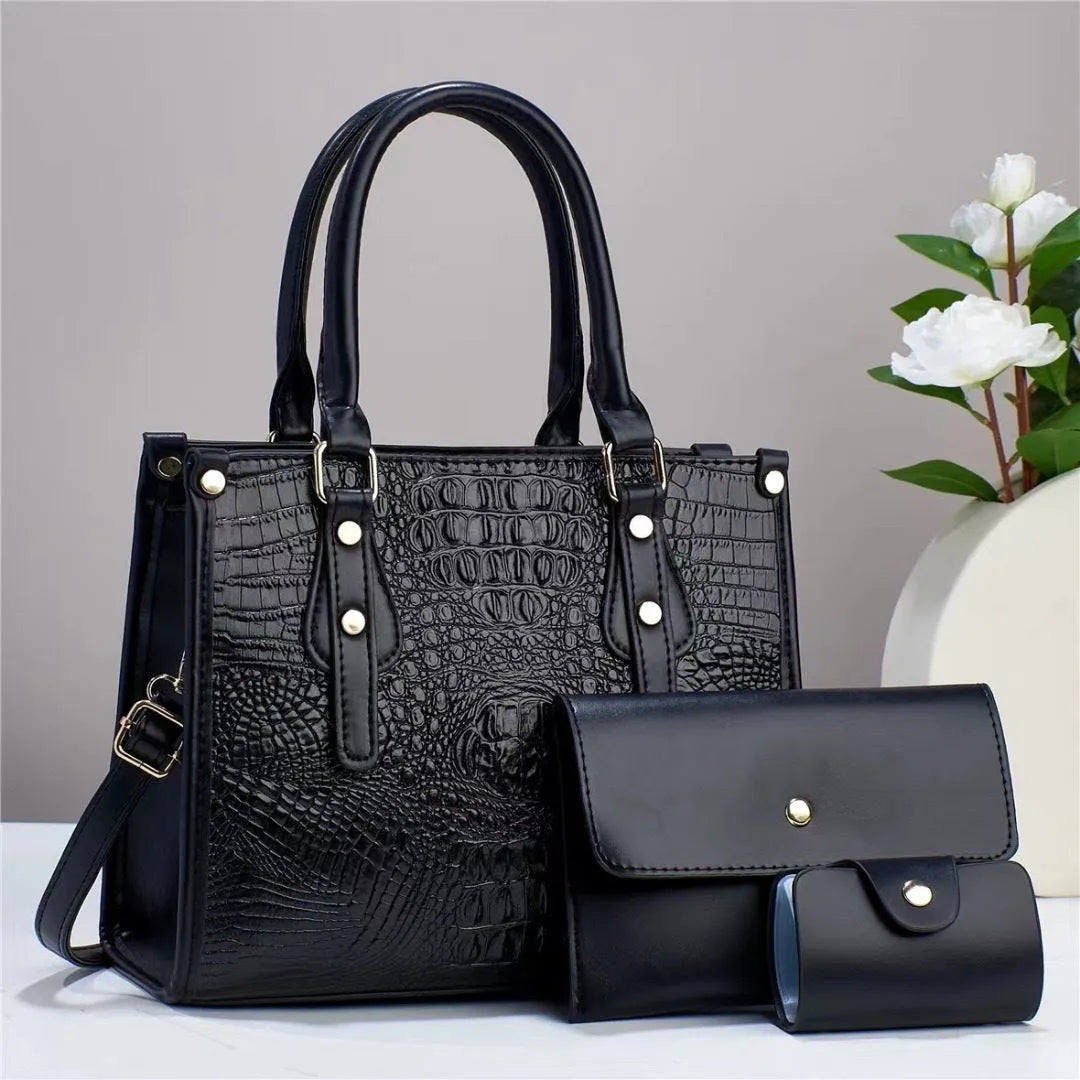 Minimalist textured PU three-piece bag set showing crossbody bag, wallet, and card holder in a contrast colour.
