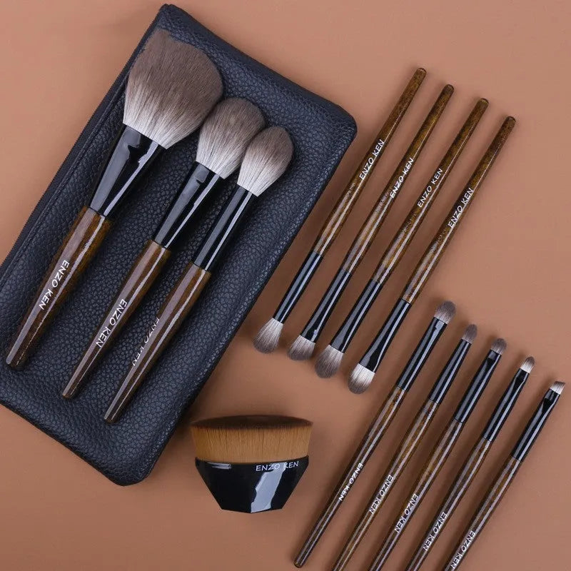 12-piece makeup brush set with wooden handles and a black PU storage pouch laid out.