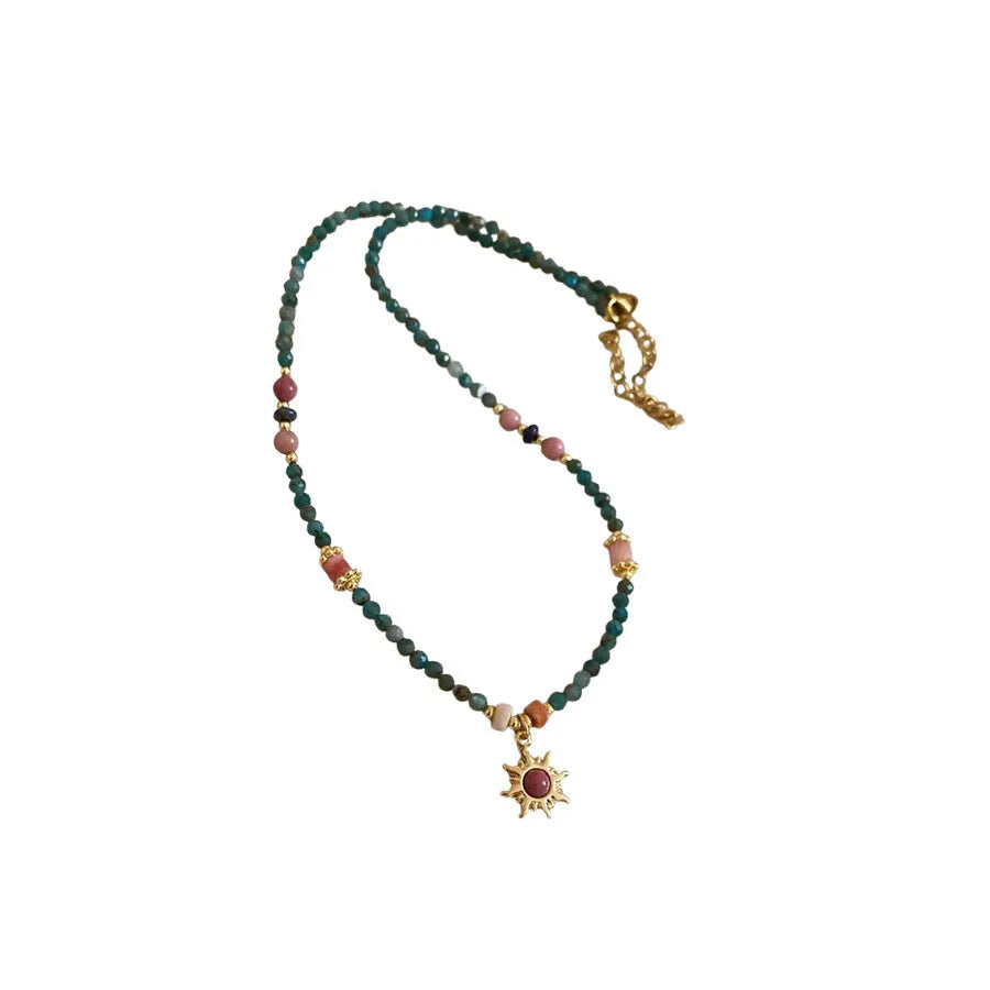 Freshwater pearl necklace with geometric stone sun pendant on clavicle chain