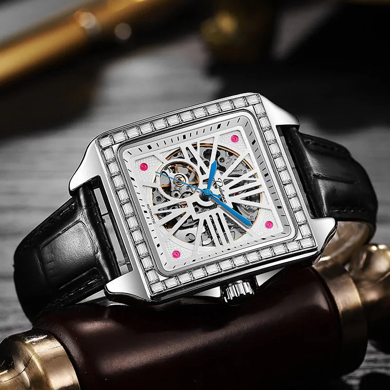 Men's square automatic watch with a diamond-studded dial on a black steel bracelet.