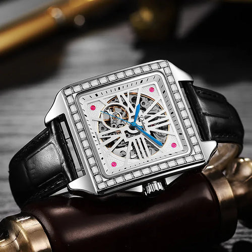 Men's square automatic watch with a diamond-studded dial on a black steel bracelet.