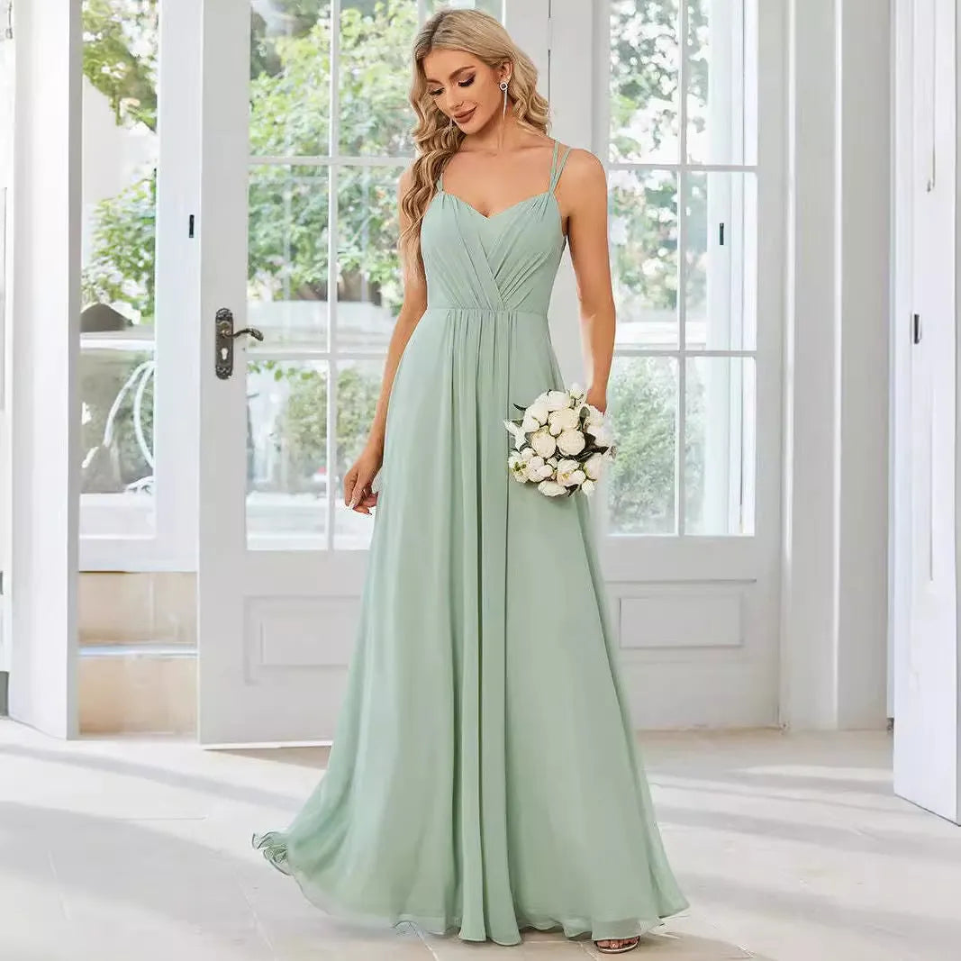 Women's light green sleeveless A-line banquet dress with long pleated skirt on a hanger.