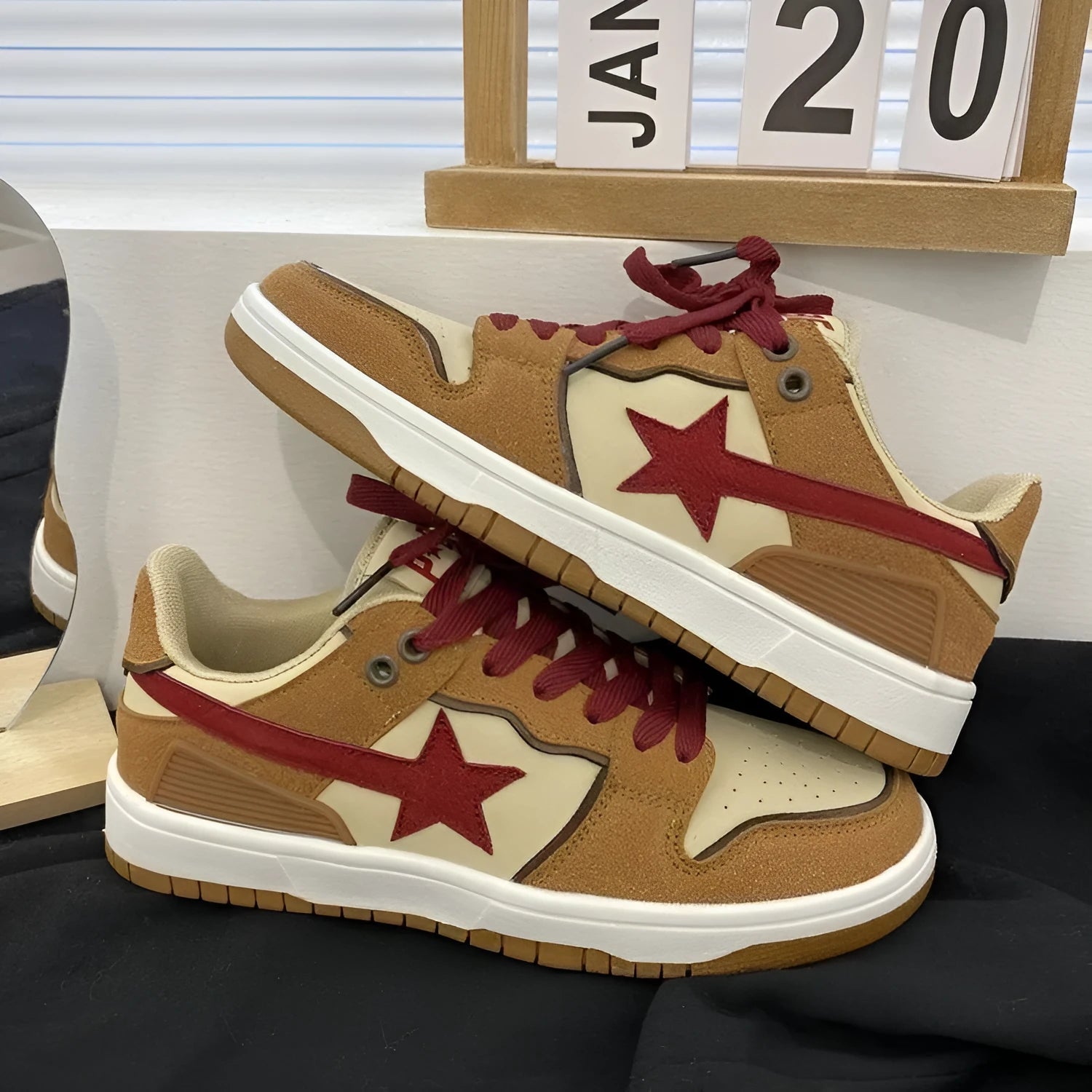 Brown women's low-top platform sneakers with sequin details and a lace-up front.