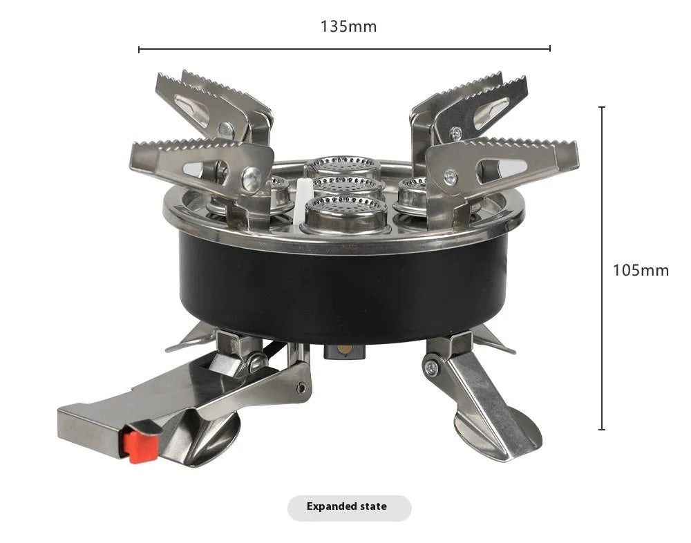 Silver portable folding camping gas stove made of stainless steel and copper with a long black hose.