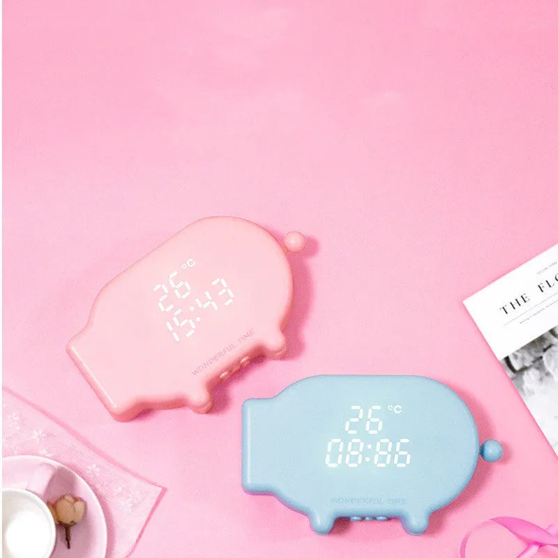 Multifunctional LED alarm clock with temperature display and USB charging port in blue or pink