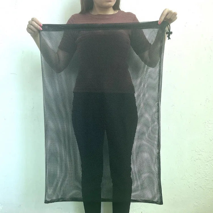 Black mesh drawstring storage bag showing grid pattern and closure