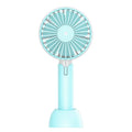Blue mini handheld USB electric fan with three-speed control on a desk