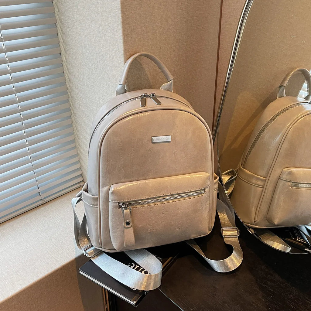 PU leather ladies travel backpack in urban simplicity style with sandwich pocket and polyester lining