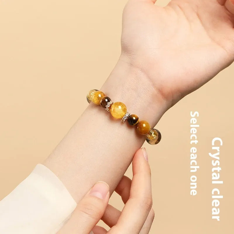 Natural yellow tiger-eye crystal bracelet in geometric tower design showing 10mm and 12mm size options