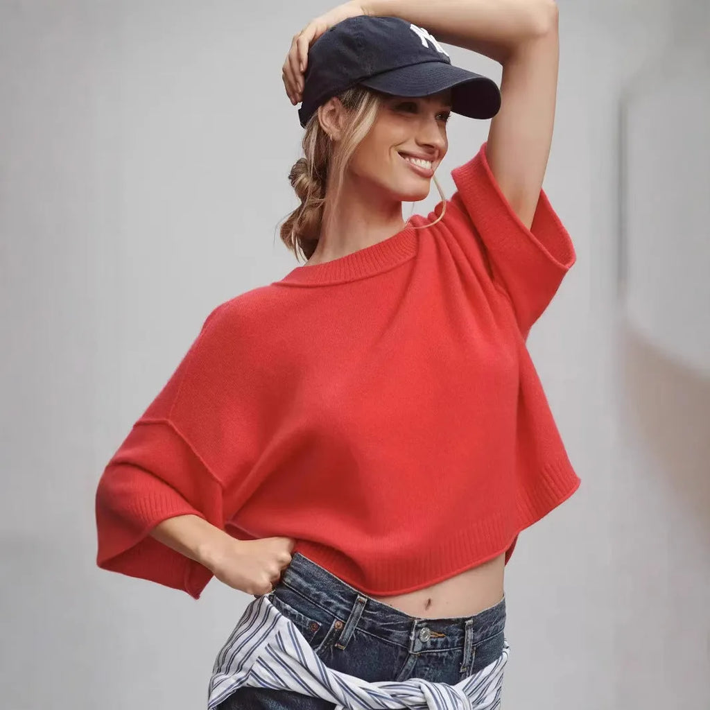 Red cropped viscose T-shirt with regular sleeves and an exposed navel design on a mannequin.