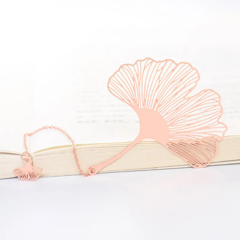 Brass metal bookmark with hollow leaf pattern design and rose gold tassel