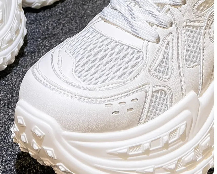 White women's height increasing dad shoes with lace-up closure and round toe, showing internal lift construction