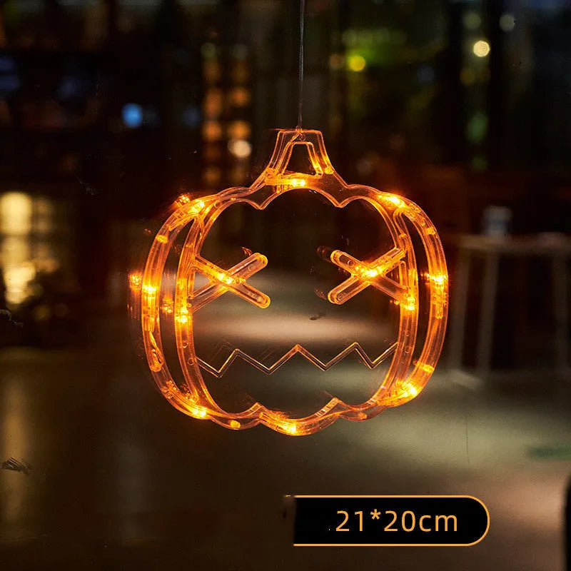 Seven Halloween-themed LED hanging lights with suction cups including spiders, pumpkins and ghosts