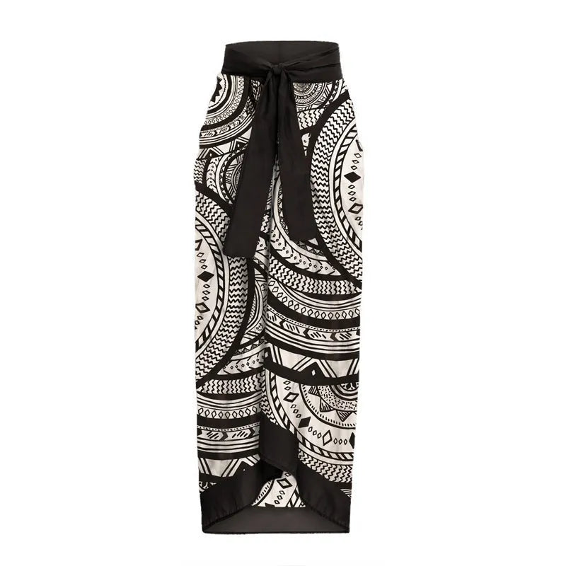 Vintage print deep V-neck one-piece swimsuit for women with matching wrap skirt.