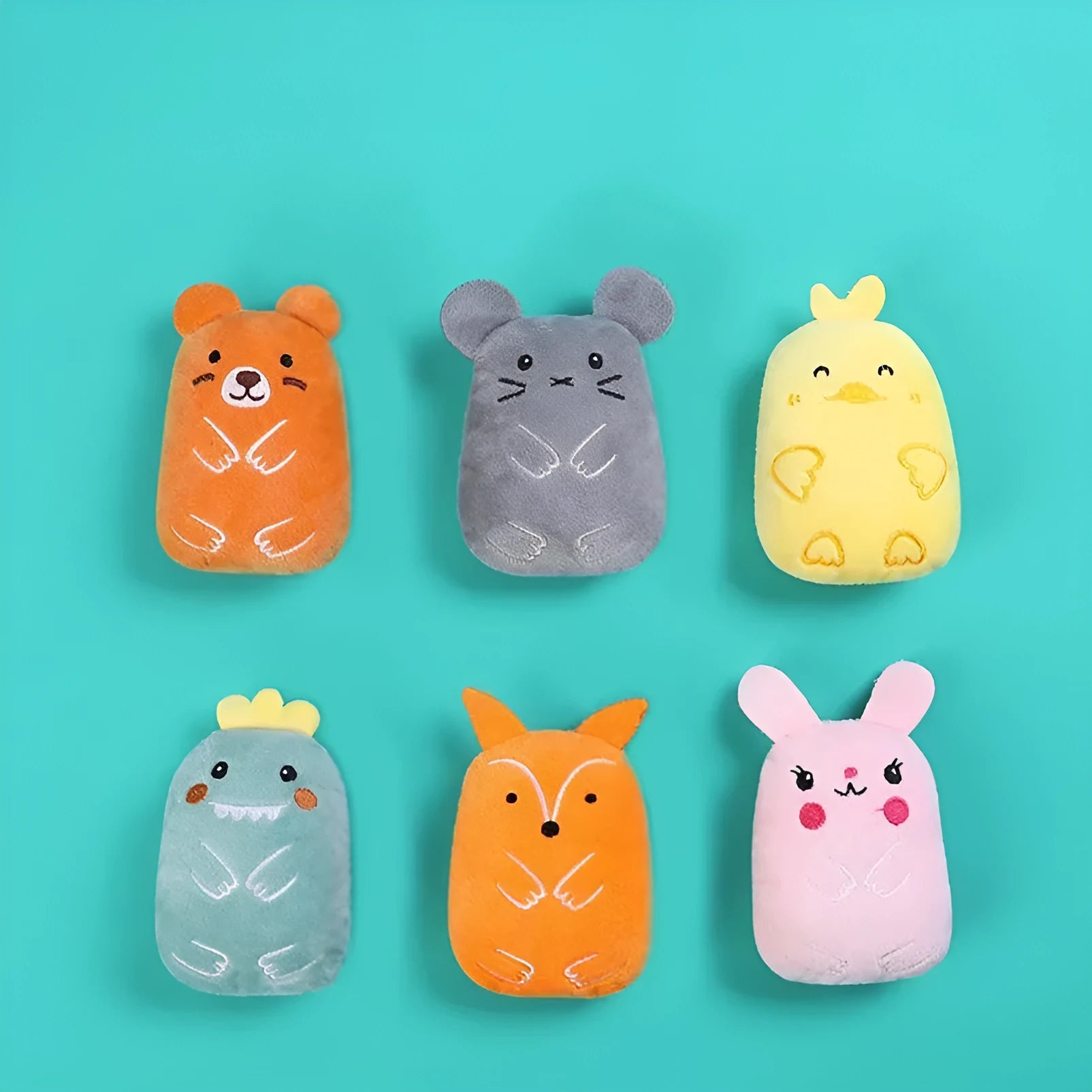 Small plush cat toy with catnip filling for chewing and teeth grinding, shown in assorted colours.