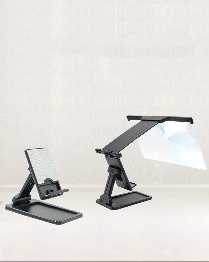 Black foldable mobile phone screen magnifier with detachable phone holder on a desk