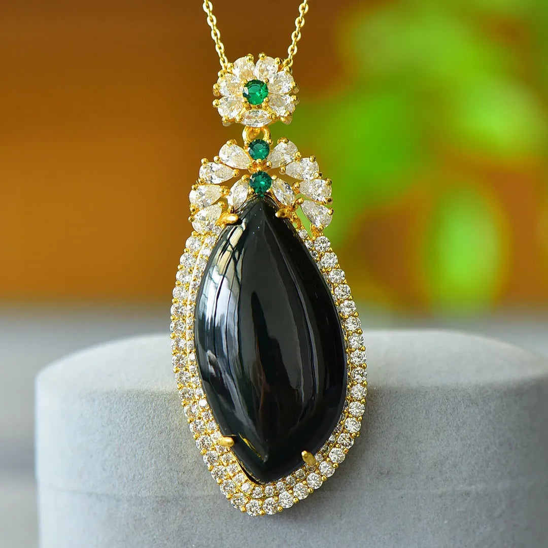 Flat geometric Hetian jade pendant with copper inlay on a necklace chain.