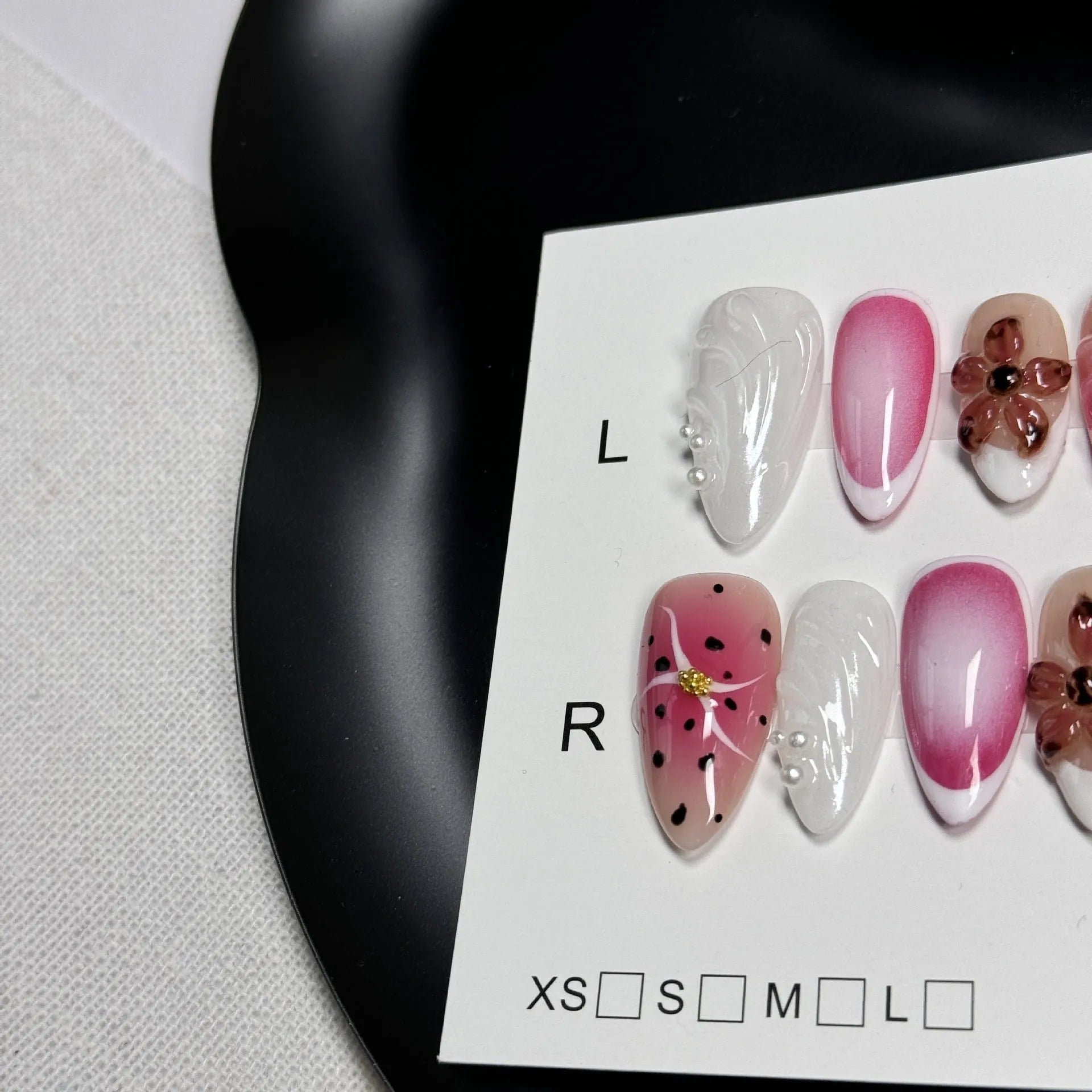 Hand-painted three-dimensional carved nail beauty patches showing embossed and candy patterns on almond-shaped nails