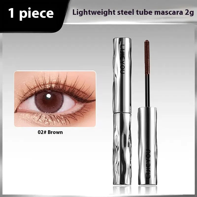 Waterproof mascara in steel tube with black and brown shades and optional eyelash curler