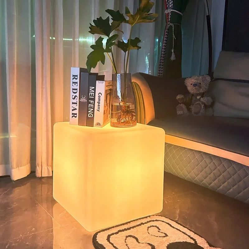 Modern white LED square cube light for outdoor garden and pathway illumination.