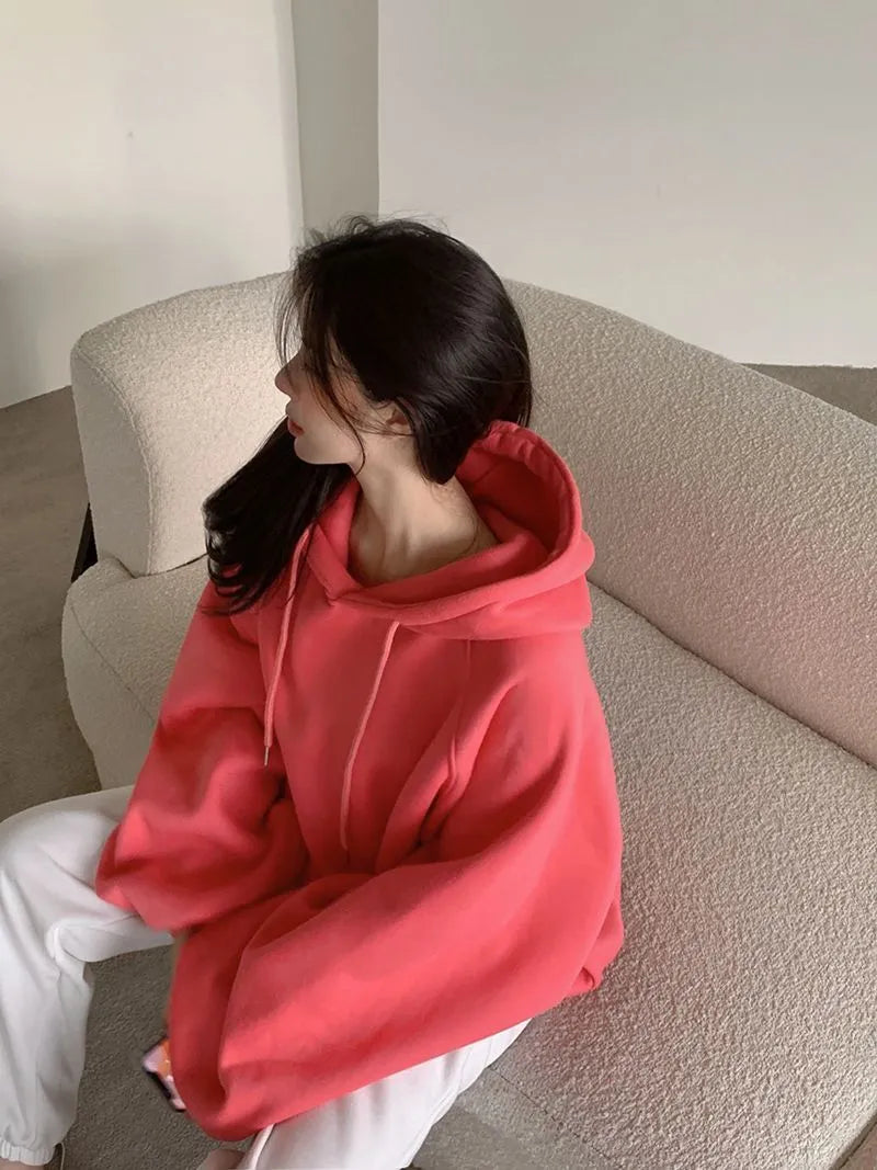 Women's loose mulberry silk hooded sweater in solid watermelon red, sleeveless design.