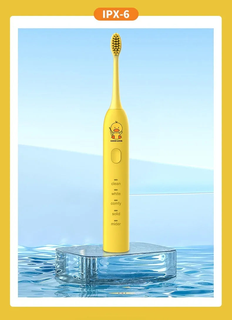 Small yellow duck design electric toothbrush with soft bristles and USB charging port