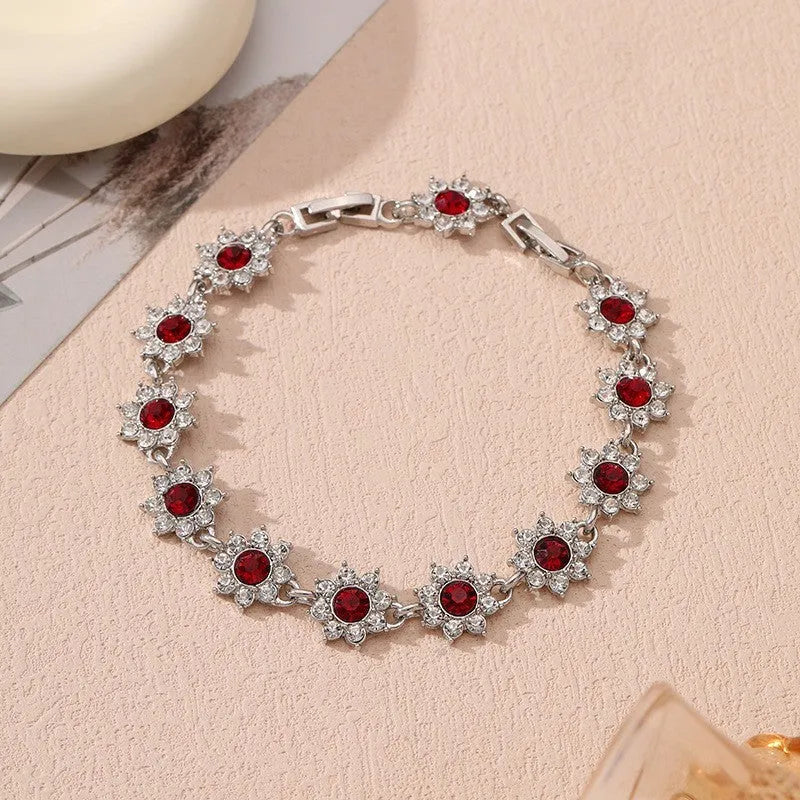 Zinc alloy flower bracelet with electroplated colour finish and colourful crystal decorations in gold and silver variations