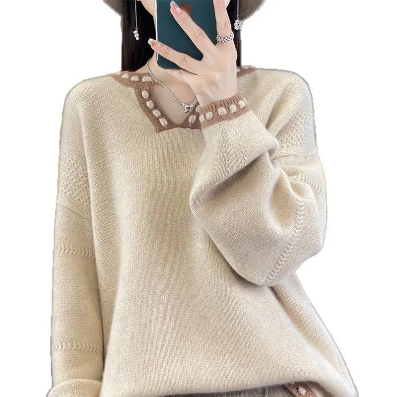 Women's camel coloured V-neck viscose sweater with long sleeves laid flat.