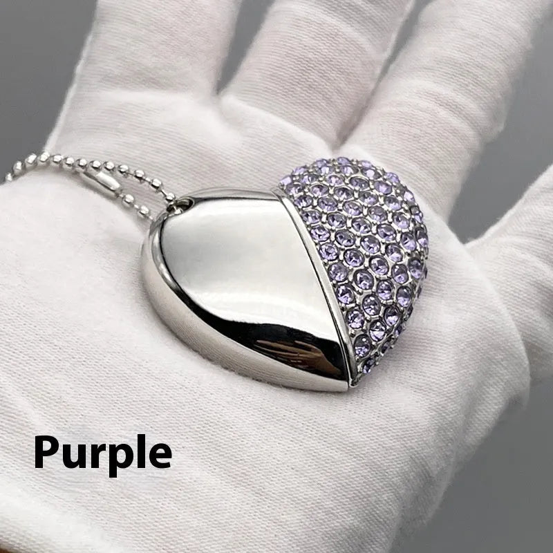 Blue heart-shaped metal USB flash drive with a brick pattern design on a white background.
