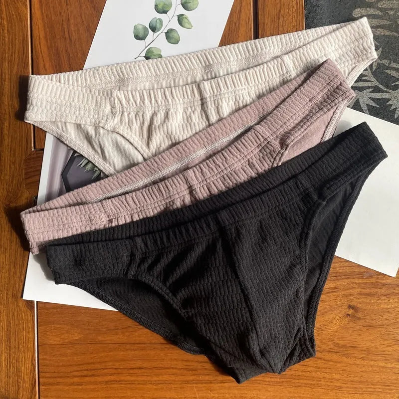 Men's cotton briefs in solid colours showing mid waist and triangle design