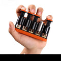 Grey and orange silicone finger trainer for musician hand strength development