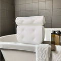 White bathtub pillow with 7 suction cups on a breathable 3d mesh material.