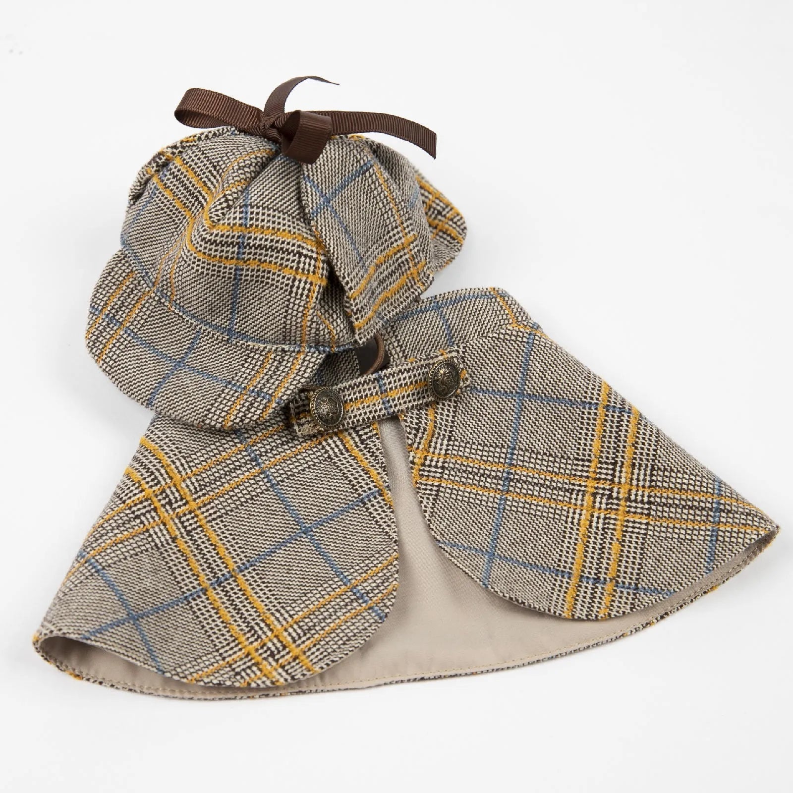 Camel-coloured cotton detective suit cloak for a small dog on a neutral background.