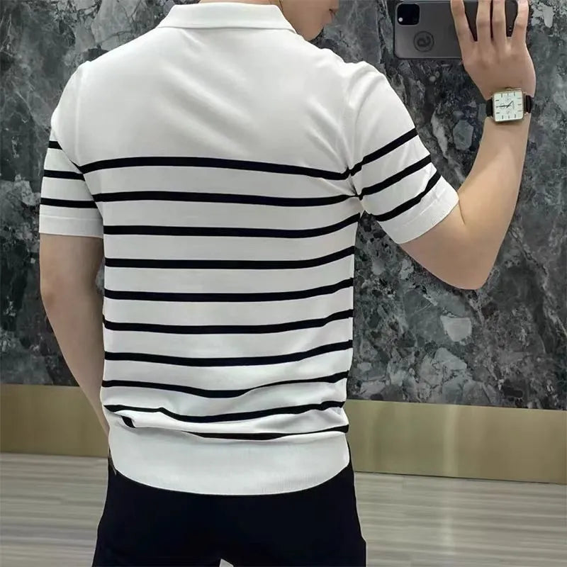 Black and white striped men's knit t-shirt with a lapel collar, laid flat.