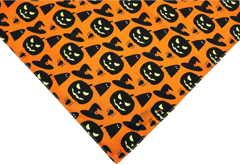 Black and orange reversible triangle dog bandana with Halloween pumpkin and spider web patterns.