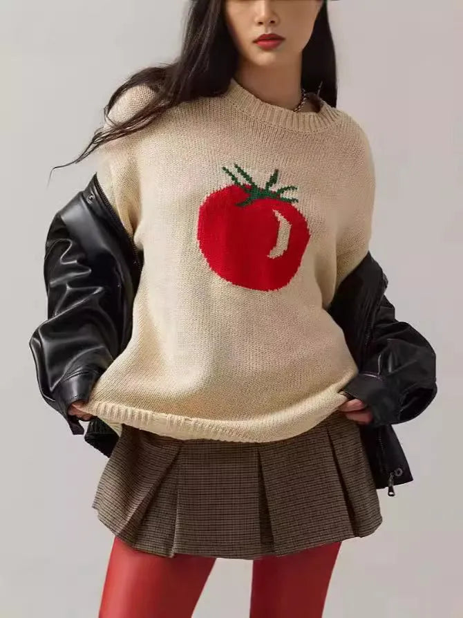 Women's beige loose-fit acrylic Jacquard knit sweater with round neck and long sleeves laid flat.