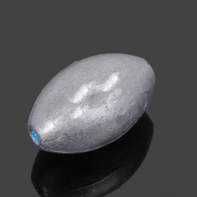 Olive lead sea fishing sinker with plastic core and scale texture, shown with weight options from 10 to 150 grams.