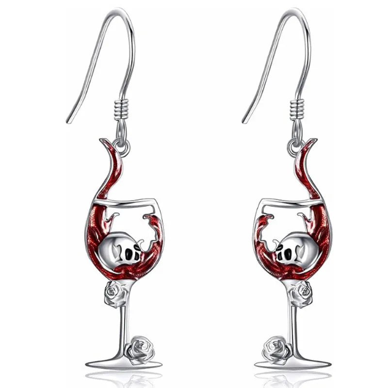 A pair of zinc alloy skull wine glass earrings with an electroplated metallic finish.