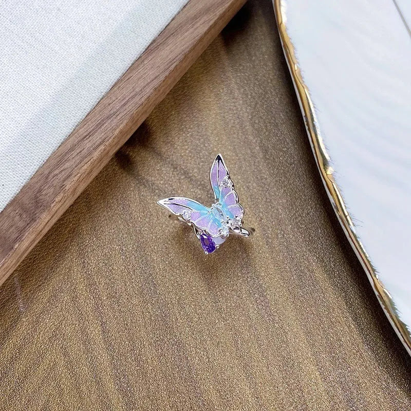 Adjustable copper insect ring with drip oil colour treatment in gold-tone finish